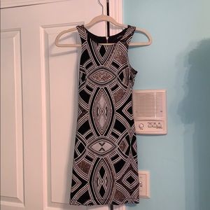 rose gold, white and black tight fitted dress.